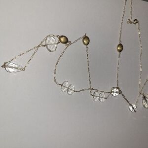 Necklace with gold and clear plastic beads